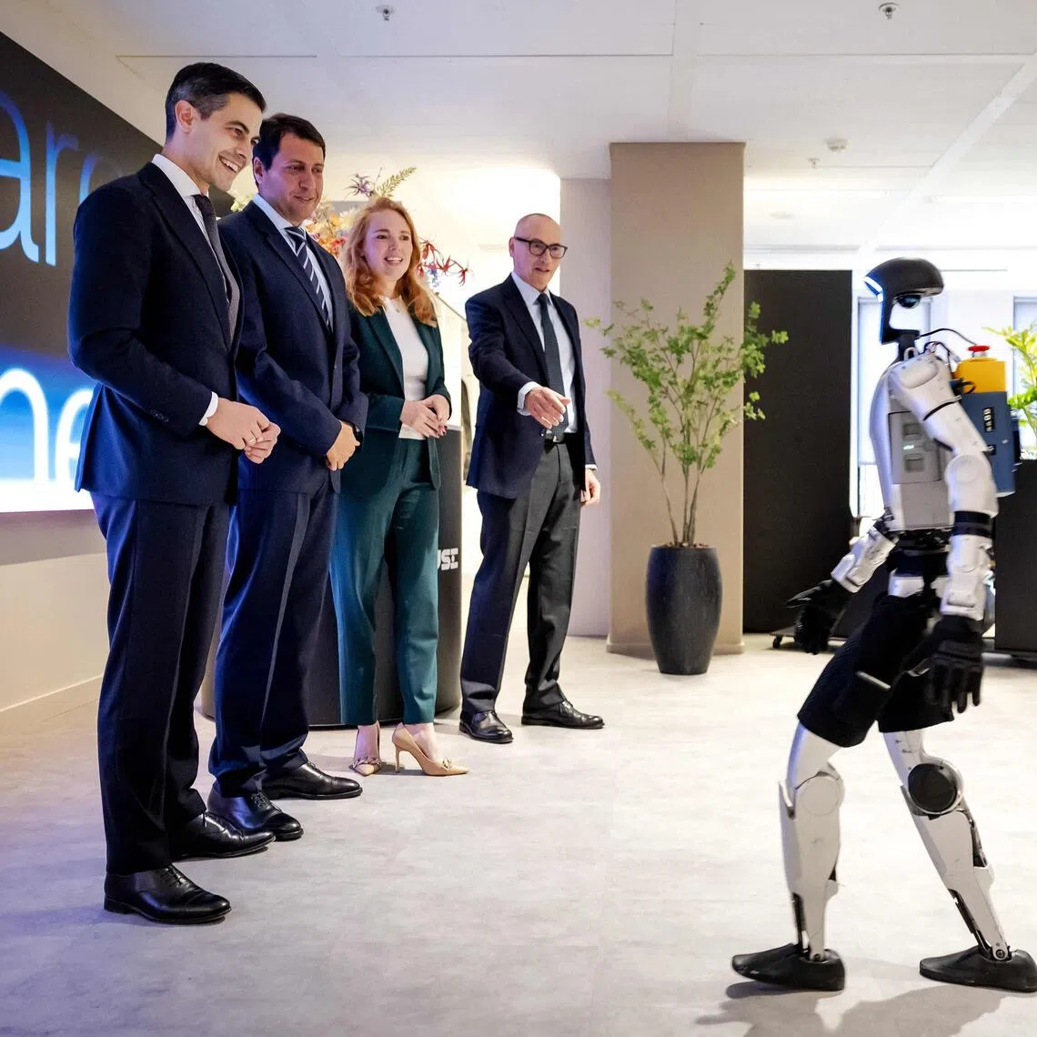 Dutch Prime Minister Rob Jetten (left) watching a demonstration by an AI robot in Amsterdam on Oct 7.