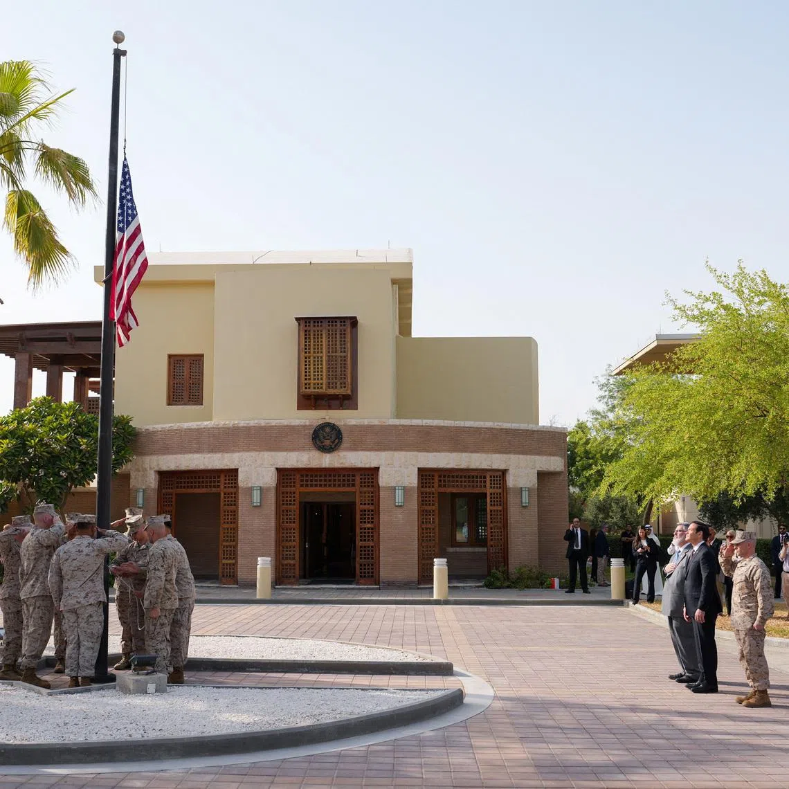U.S. Secretary of State Marco Rubio and Steven Butler, charge d'affaires ad interim of the U.S. embassy in Kuwait, attend a flag raising ceremony at the U.S. embassy during Rubio's visit to the Middle East to discuss the interim deal between the U.S. and Iran with Arab Gulf allies, in Kuwait City, Kuwait, June 24, 2026. REUTERS/Eric Lee/Pool