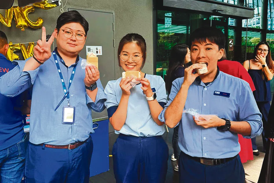 Holiday Inn Express Singapore Clarke Quay employees enjoying treats during a week of appreciation activities