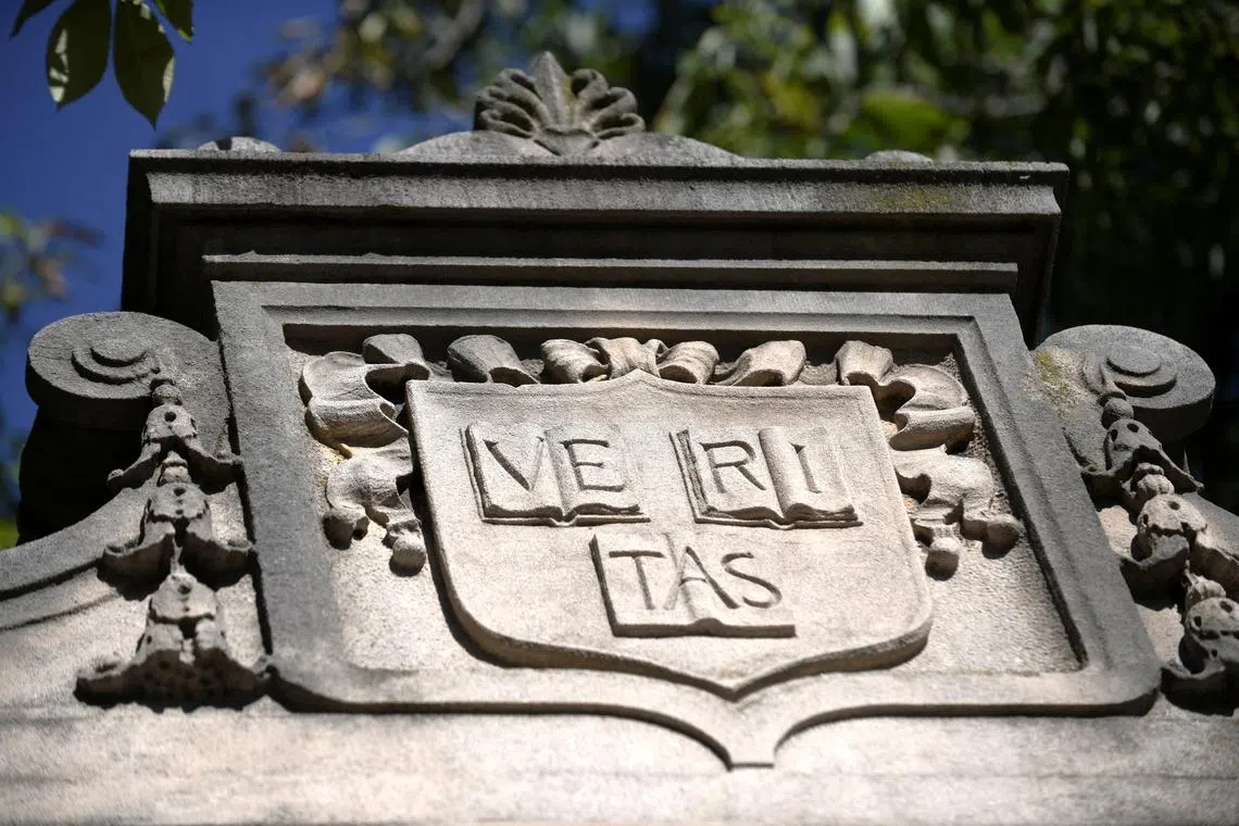 FILE PHOTO: A stone carving of Harvard's motto \"Veritas\" above a gated entrance to Harvard Yard is pictured on the first day of the fall semester at Harvard University in Cambridge, Massachusetts, U.S., September 3, 2024. REUTERS/Nicholas Pfosi/File Photo