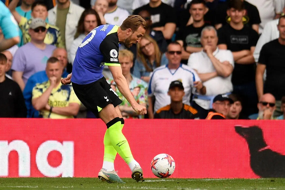 Tottenham Hotspur's English striker Harry Kane shoots to score their third goal.