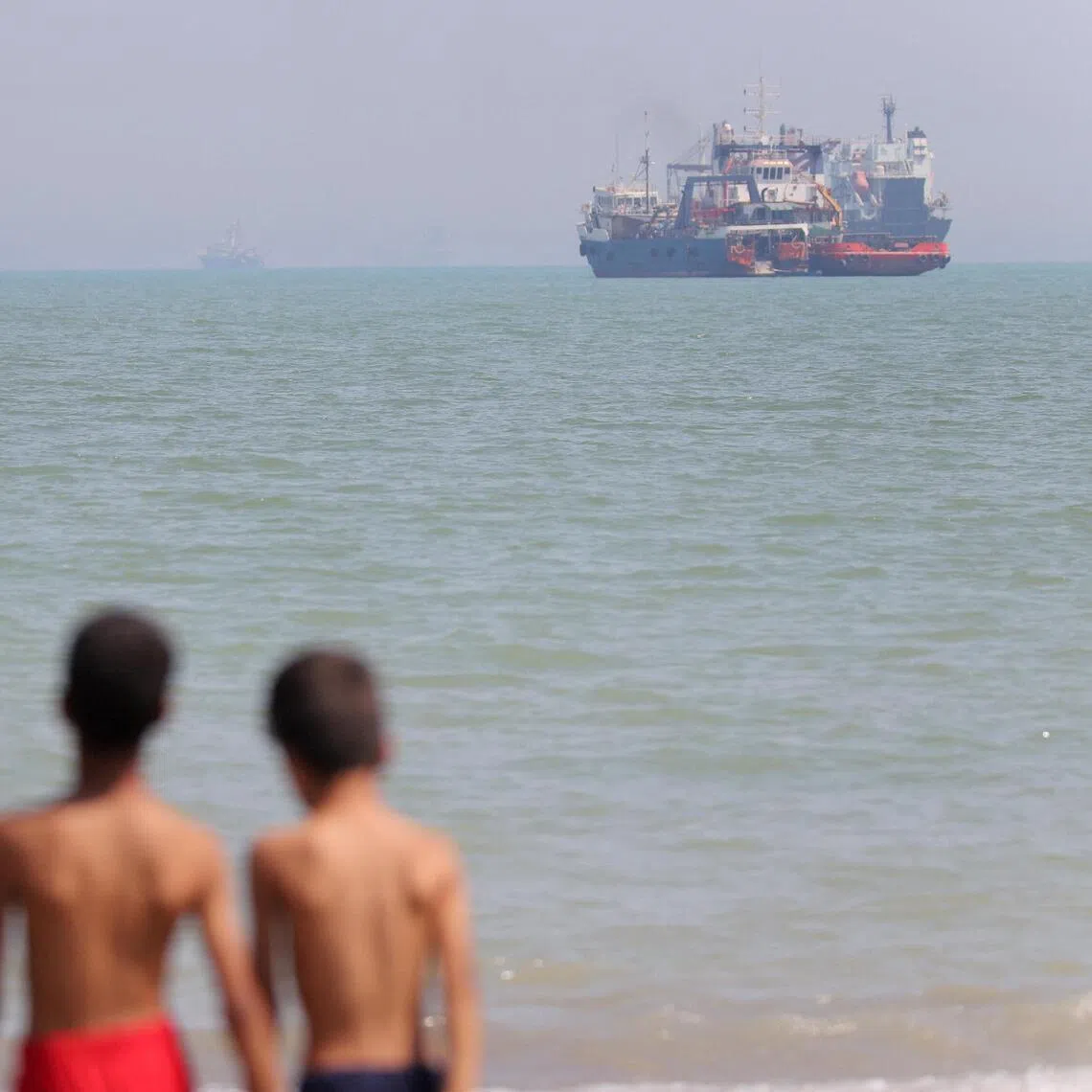 Vessels in the Strait of Hormuz, near the beach of Bandar Abbas, Iran, on June 11.