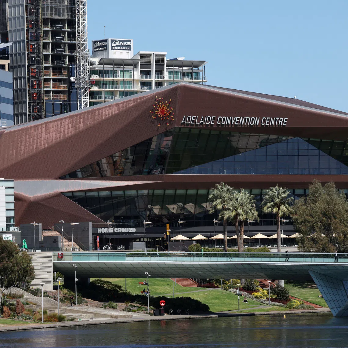 FILE PHOTO: The Adelaide Convention Centre, proposed as the primary venue for Australia’s bid to host the COP31 climate change conference, overlooks the River Torrens in Adelaide, Australia, September 18, 2025. REUTERS/Hollie Adams./File Photo