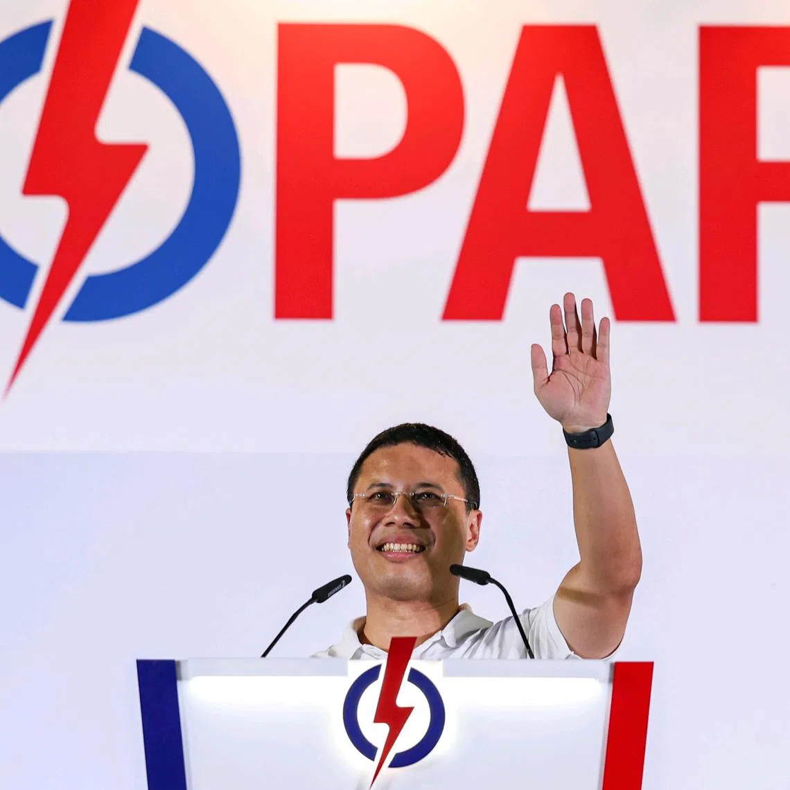 Minister for National Development Desmond Lee speaking to supporters during the PAP's rally at Jurong West Stadium on April 27.