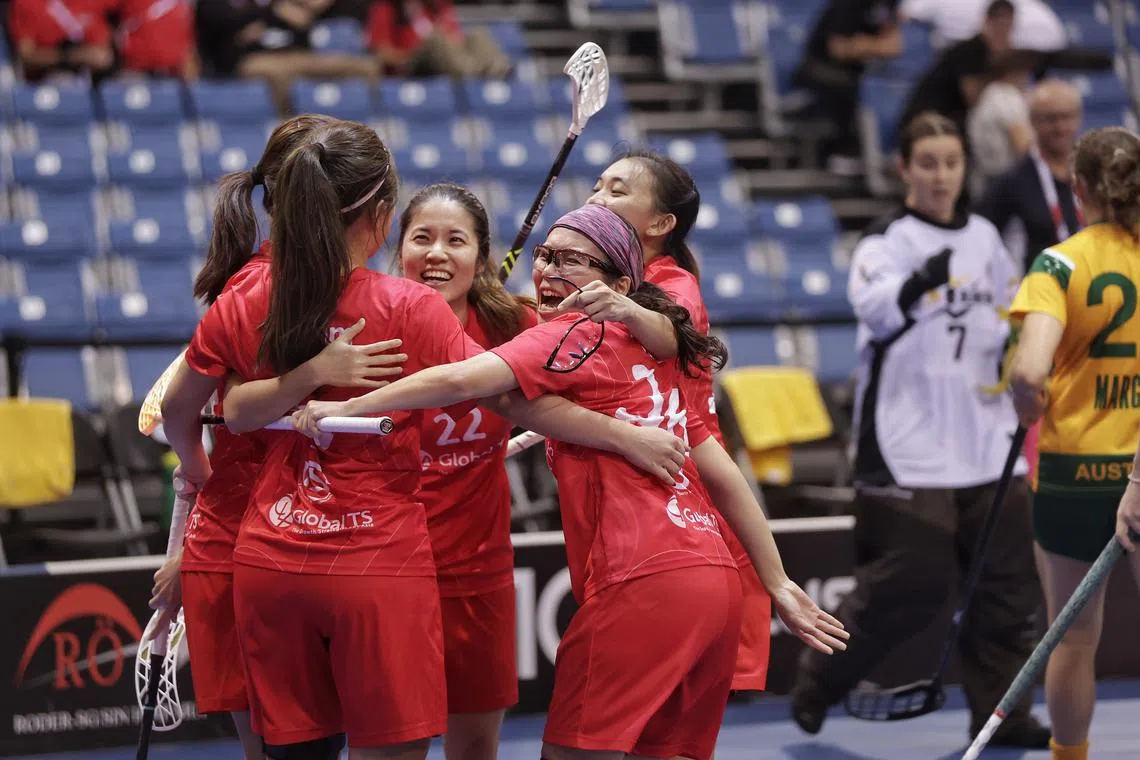 Singapore's floorballers celebrating a goal during their 4-2 victory over Australia in the Women's World Floorball Championship.