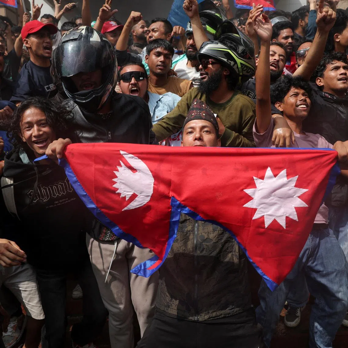 Demonstrators celebrating after entering the Parliament complex in Kathmandu on Sept 9.