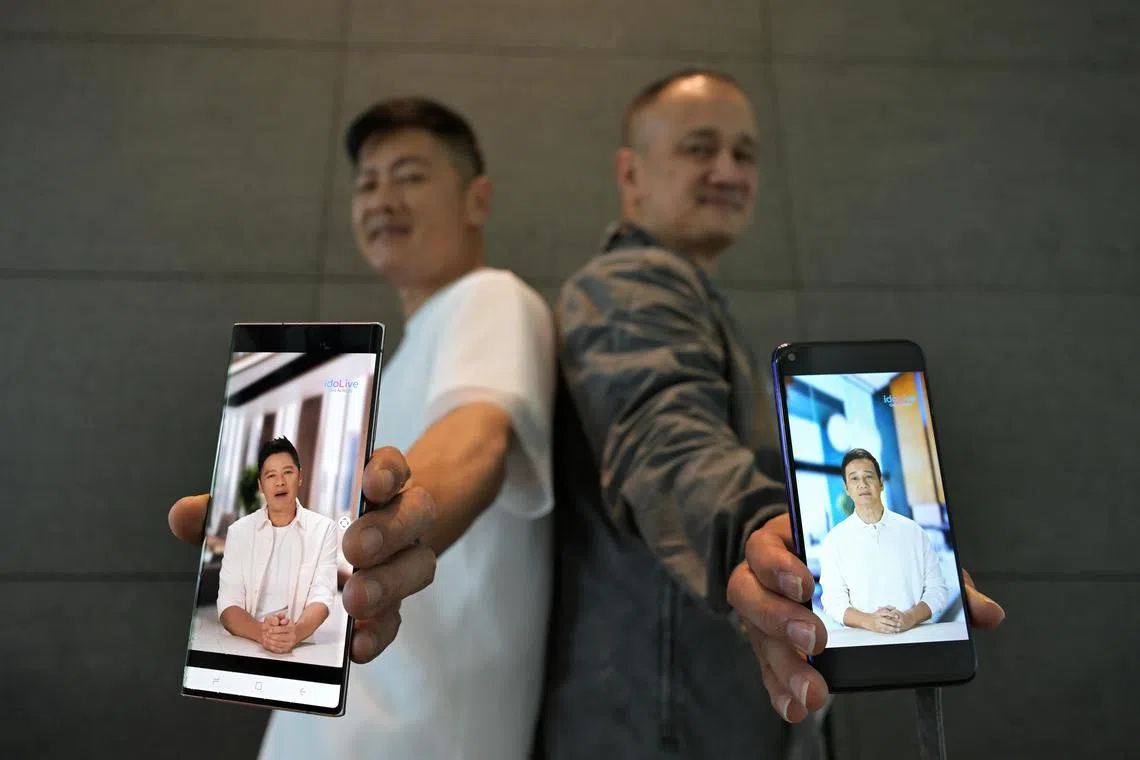 Local celebrities Li Nan Xing (left) and Gurmit Singh (right) with their AI-generated avatars at a press conference to launch IdoLive, an AI celebrity marketing solution, on March 22, 2024.