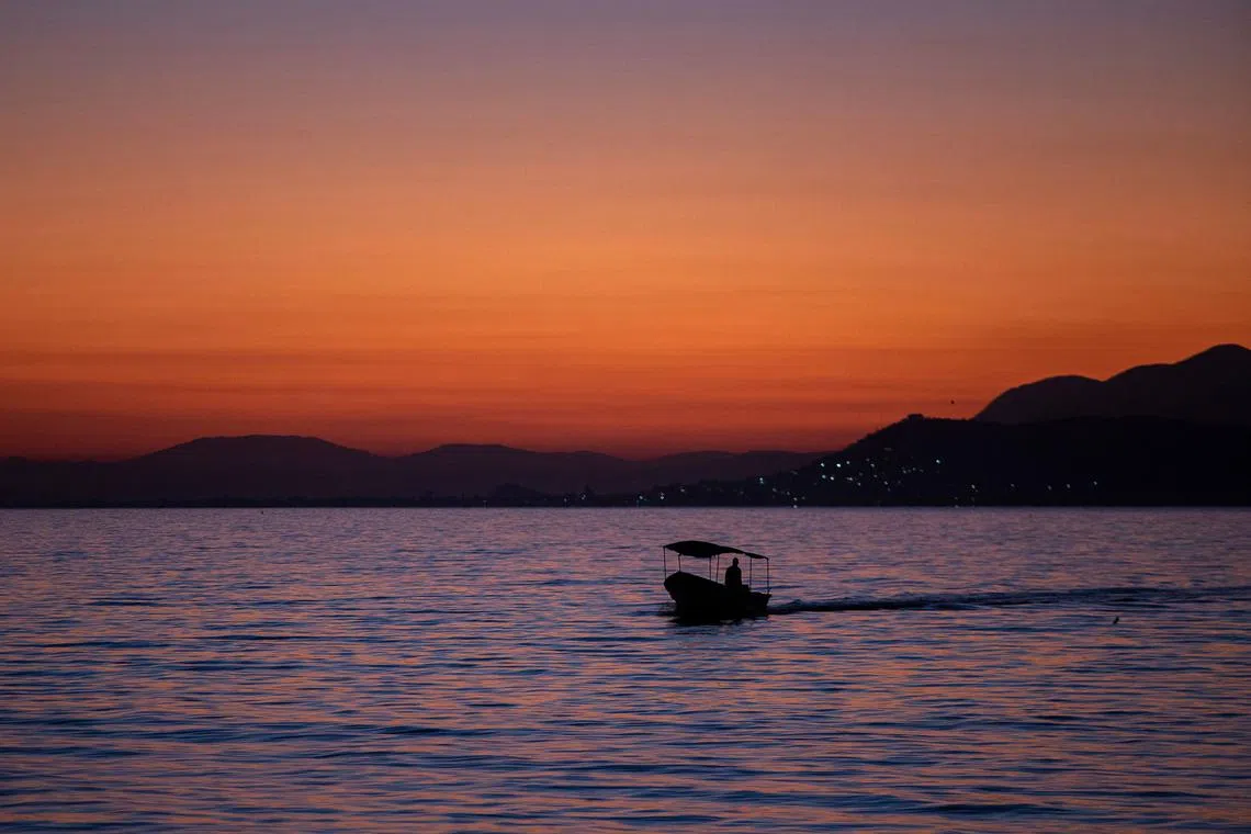 A fishing boat approaching the island of Petatan in the municipality of Cojumatlan de Regules, Michoacan state, Mexico on Feb 23, 2024.