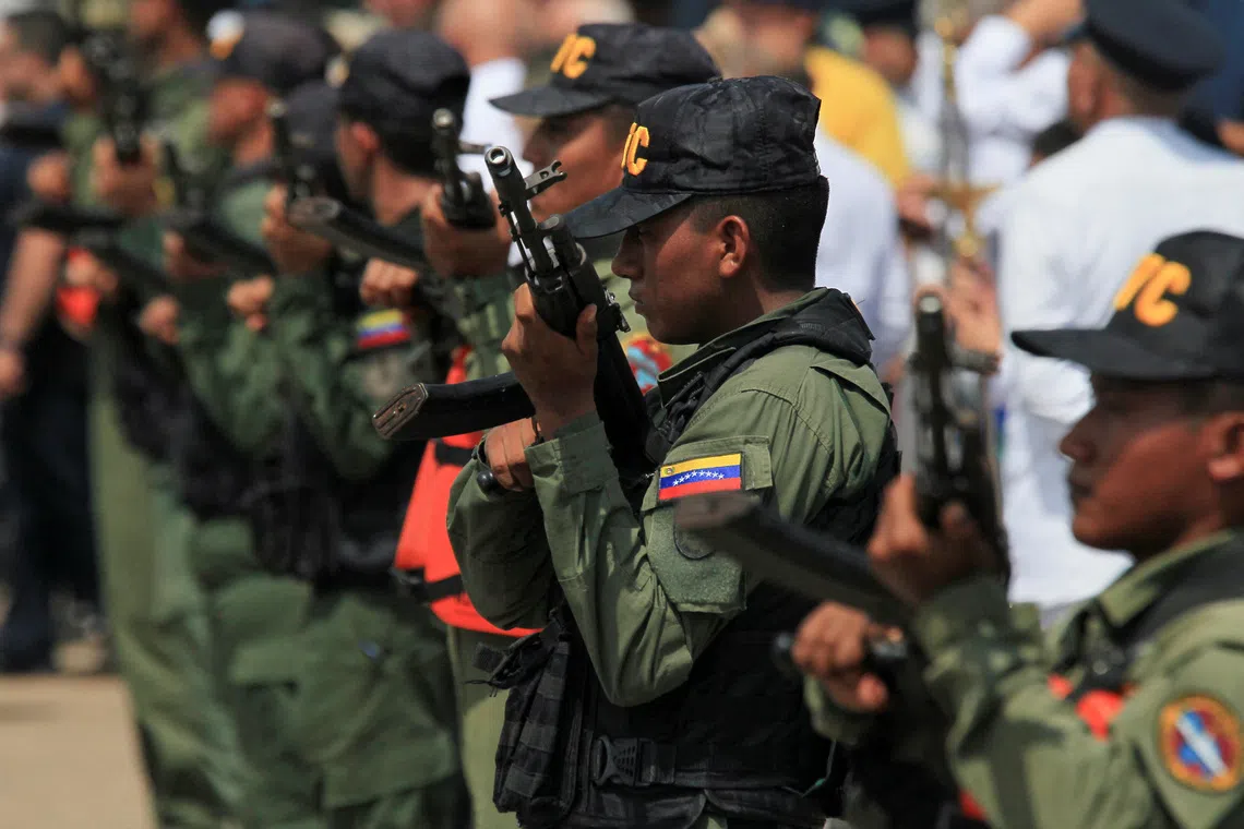 Members of Venezuela's Bolivarian National Guard stand in formation as they carry out an increased security patrol along Lake Maracaibo amid rising tensions between Venezuela and U.S., in Maracaibo, Venezuela, October 26, 2025. REUTERS/Isaac Urrutia