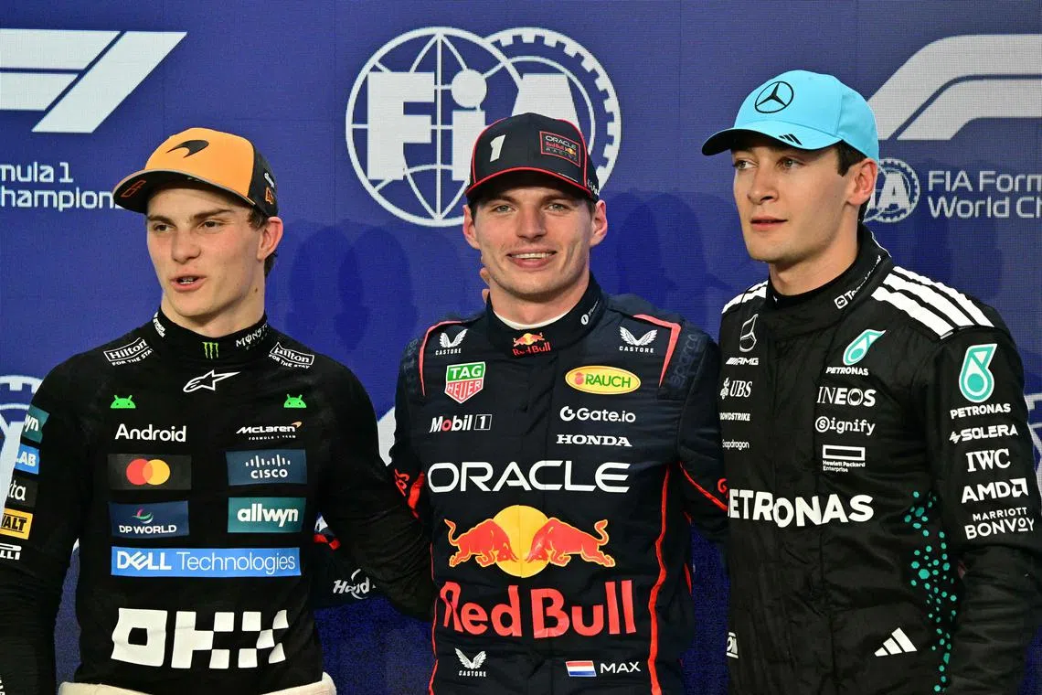 Red Bull's Max Verstappen (centre), with McLaren driver Oscar Piastri (left) and Mercedes' George Russell after the qualifying session.