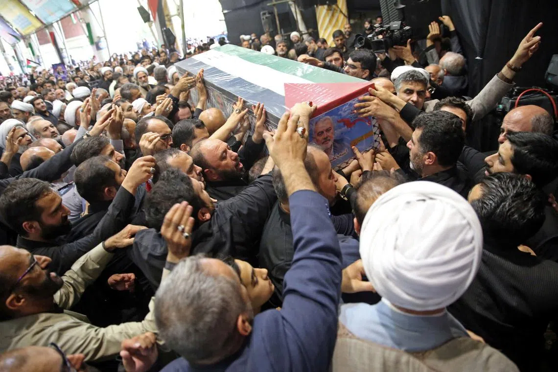 Mourners carry the coffin of assassinated Hamas chief, Ismail Haniyeh during his funeral ceremony in Tehran, Iran, August 1, 2024. Office of the Iranian Supreme Leader/WANA (West Asia News Agency) Handout via REUTERS