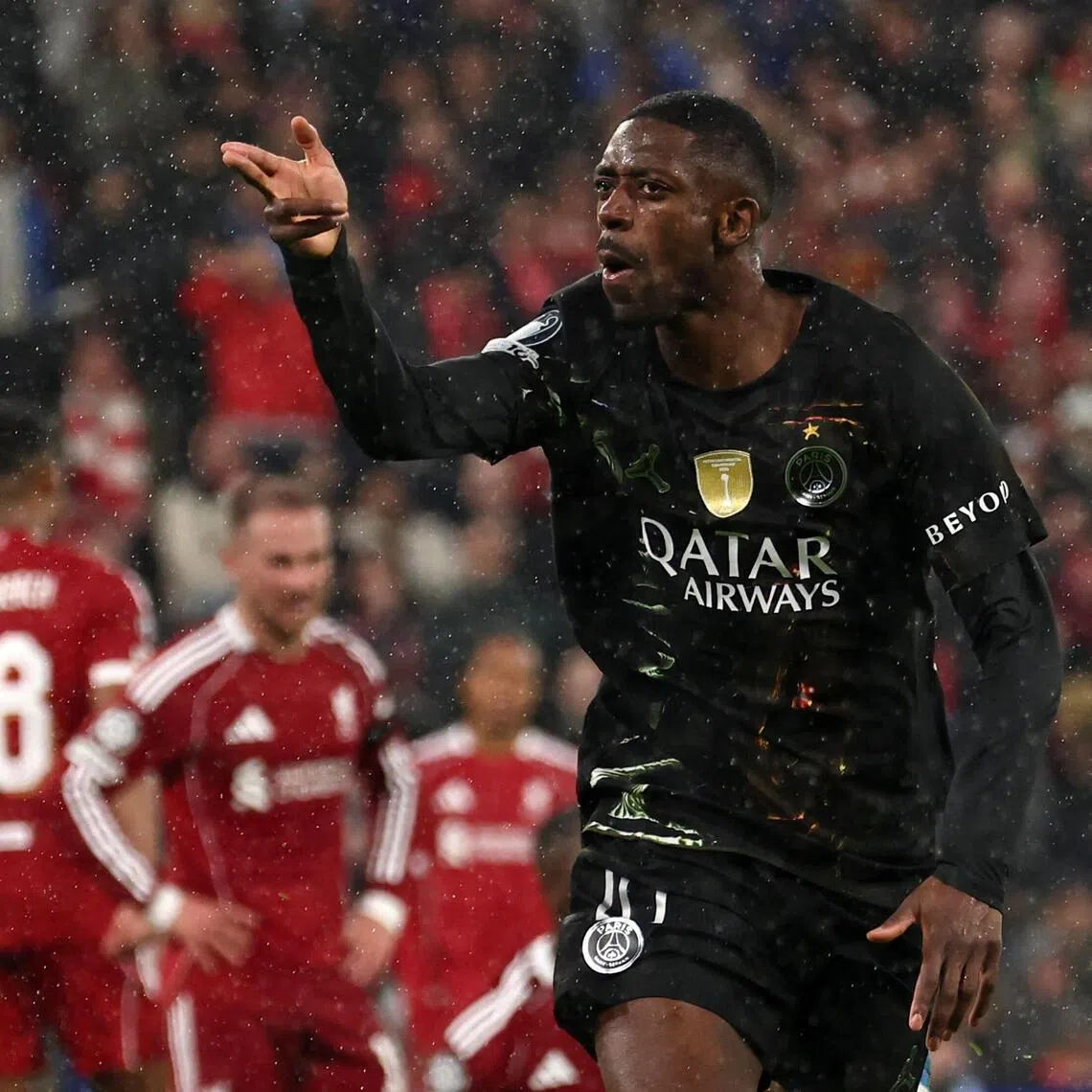 Paris Saint-Germain's Ousmane Dembele celebrates scoring his team's first goal against Liverpool, during their Champions League quarter-final, second-leg match on April 14.