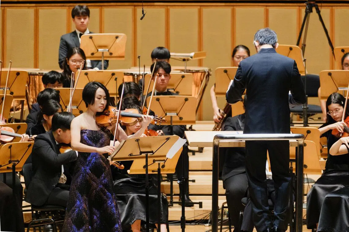 International soloist and violin professor Zhi-Jong Wang at the Shanghai Conservatory of Music played with the Singapore National Youth Orchestra at its pre-tour concert on June 7. 