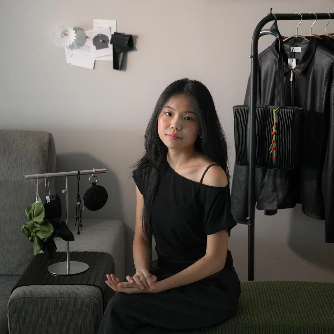 Apple Lau, the founder of Aomorie, with her coffee leather jackets and pleated Bloom bag.