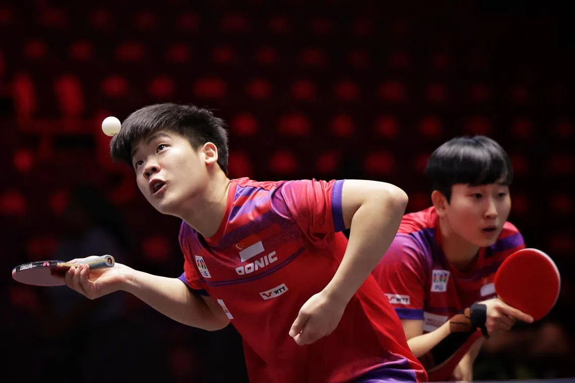 Singapore’s Izaac Quek (left) and Zhou Jingyi beating Slovakia’s Tatiana Kukulkova and Hong Kong’s Lam Siu Hang 3-0 (11-9, 11-9, 11-1) in their mixed doubles last-32 clash at the Singapore Smash tournament at the OCBC Arena on March 10. 