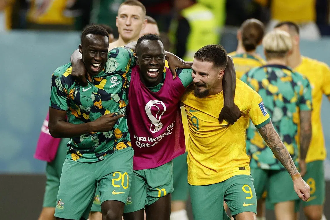 Awer Mabil (centre) was a part of Australia's squad at the World Cup in Qatar.