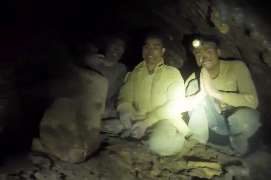 Rescuers pull first trapped person from flooded Laos cave