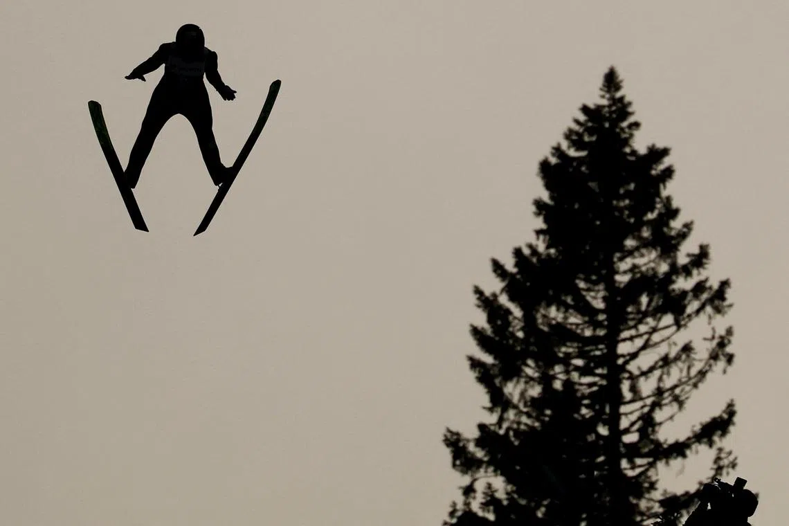 FILE PHOTO: Nordic Skiing - FIS Nordic World Ski Championships - Trondheim, Norway - March 8, 2025. A ski jumper in action during men's large hill first round REUTERS/Kai Pfaffenbach/File Photo
