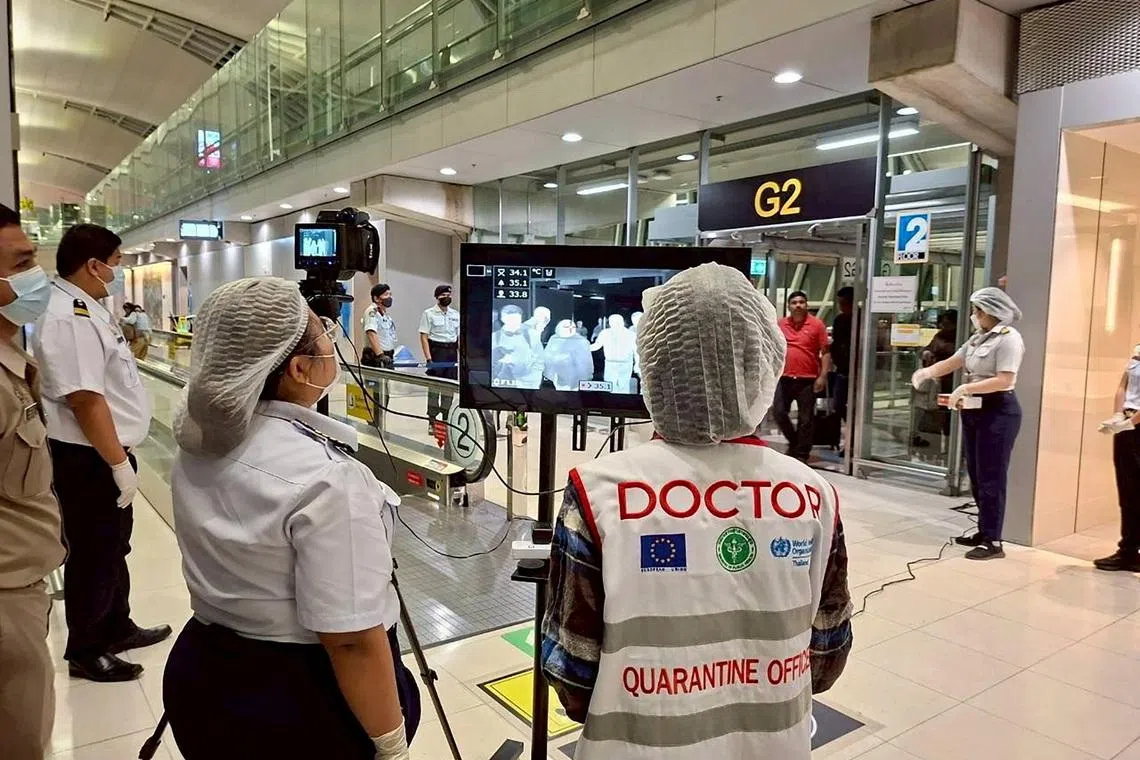 Airport health authorities wearing protective masks monitor passengers from international flights arriving at Suvarnabhumi International Airport in Bangkok, Thailand, January 25, 2026, following the implementation of health screening measures for passengers arriving from West Bengal, India, amid reports of a Nipah virus outbreak. Suvarnabhumi Airport Office /Handout via REUTERS