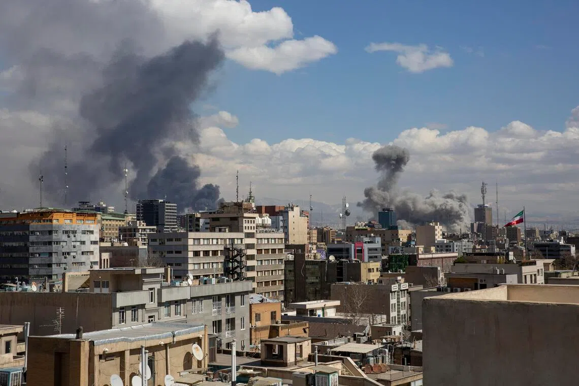 Smoke rising after coordinated US and Israeli air strikes in Tehran on  March 1, 2026. 