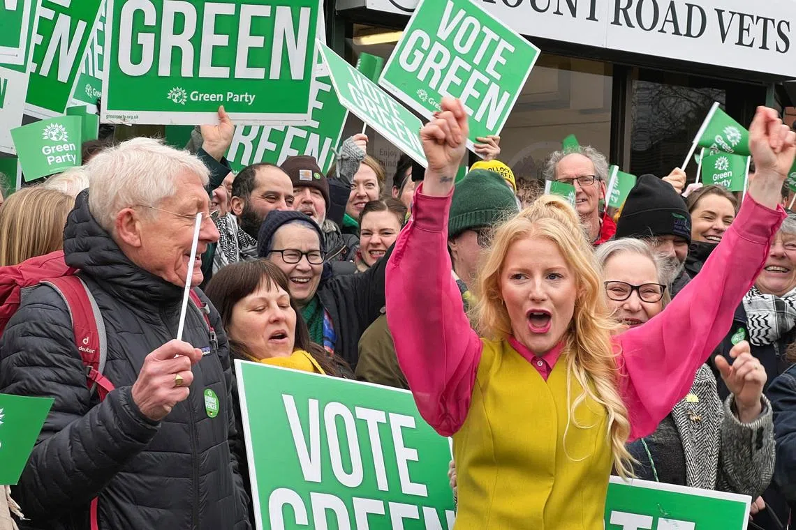 Hannah Spencer, Green Party's candidate for the Gorton and Denton by-election in Manchester, joins supporters for a campaign, in Manchester, Britain, February 13, 2026. REUTERS/Andy Bruce