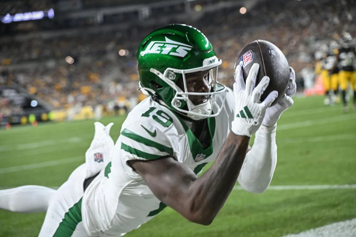 FILE PHOTO: Oct 20, 2024; Pittsburgh, Pennsylvania, USA; New York Jets wide receiver Irvin Charles (19) attempts to catch a pass against the Pittsburgh Steelers during the third quarter at Acrisure Stadium. Mandatory Credit: Barry Reeger-Imagn Images/File Photo