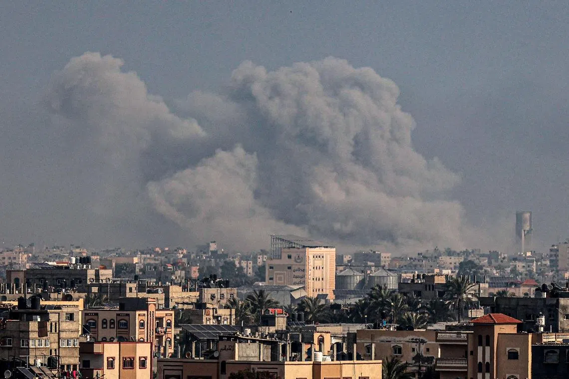 Smoke billowing over Khan Younis in the southern Gaza Strip during Israeli bombardment on Jan 17, 2024.