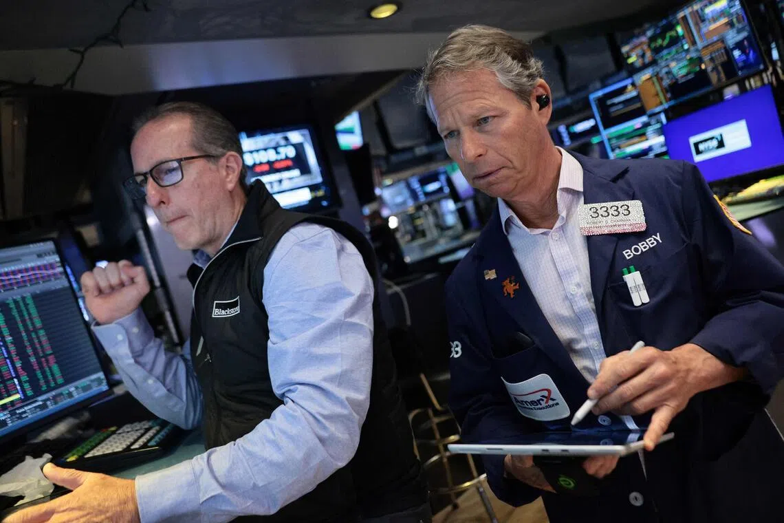 Traders working on the floor of the New York Stock Exchange during morning trading on May 20, in New York City.