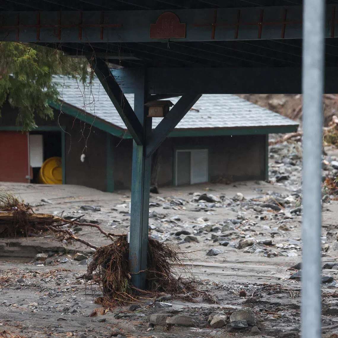 Several dozen homes were heavily damaged by rivers of mud that poured through the town of Wrightwood in California on Dec 24.