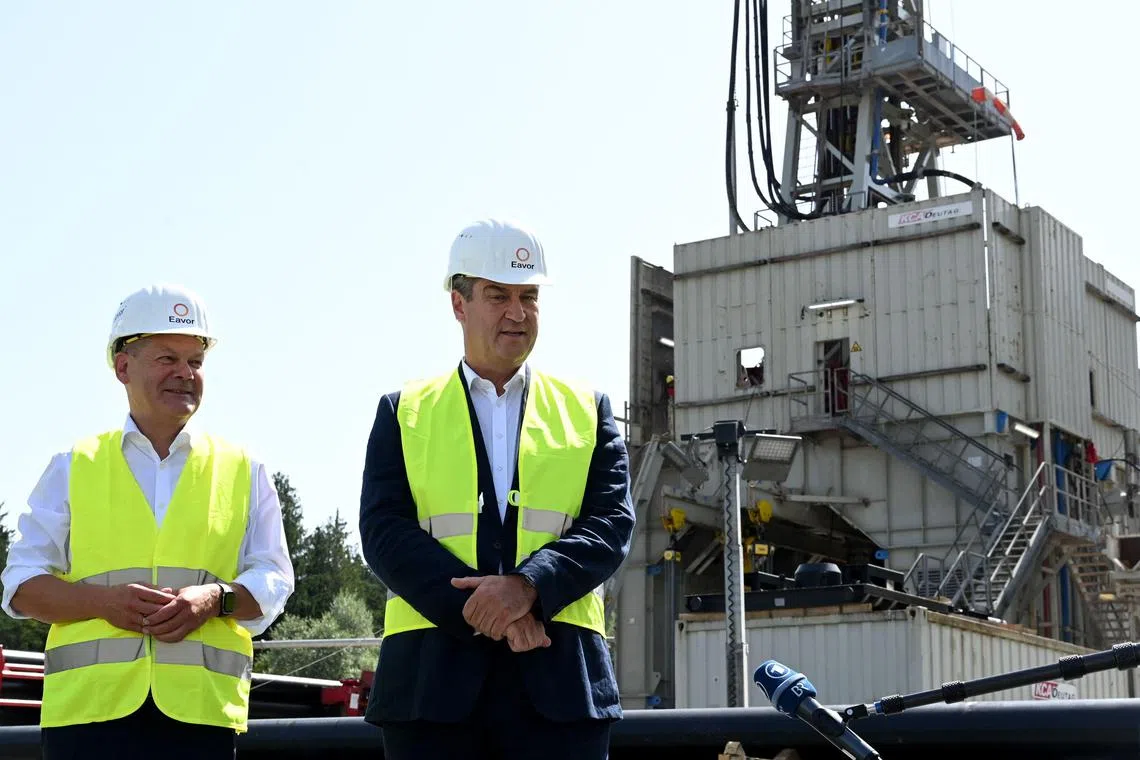 German Chancellor Olaf Scholz (left) and Bavarian State Premier Markus Soeder visit a "green energy" geothermal power station in southern Germany.