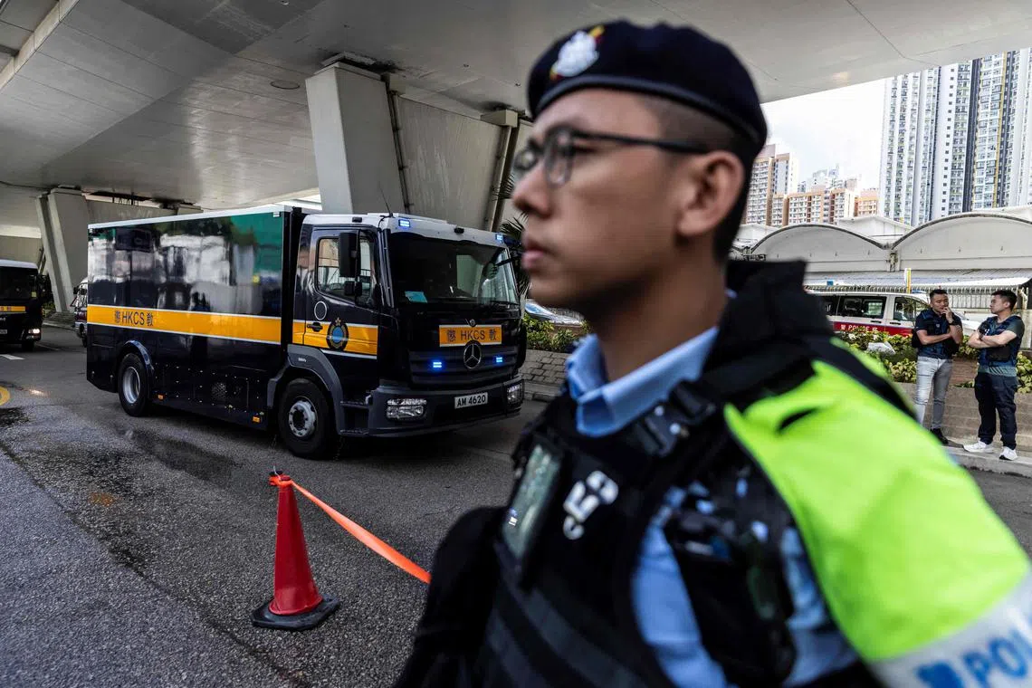 A correctional services van (L) holding Jimmy Lai arrives at the West Kowloon court after Hong Kong media mogul Jimmy Lai arrived for his  national security trial in Hong Kong on August 15, 2025. Jailed Hong Kong media mogul Jimmy Lai's national security trial, which began in late 2023, will enter its final stages on August 15, as lawyers present closing arguments. (Photo by ISAAC LAWRENCE / AFP)
