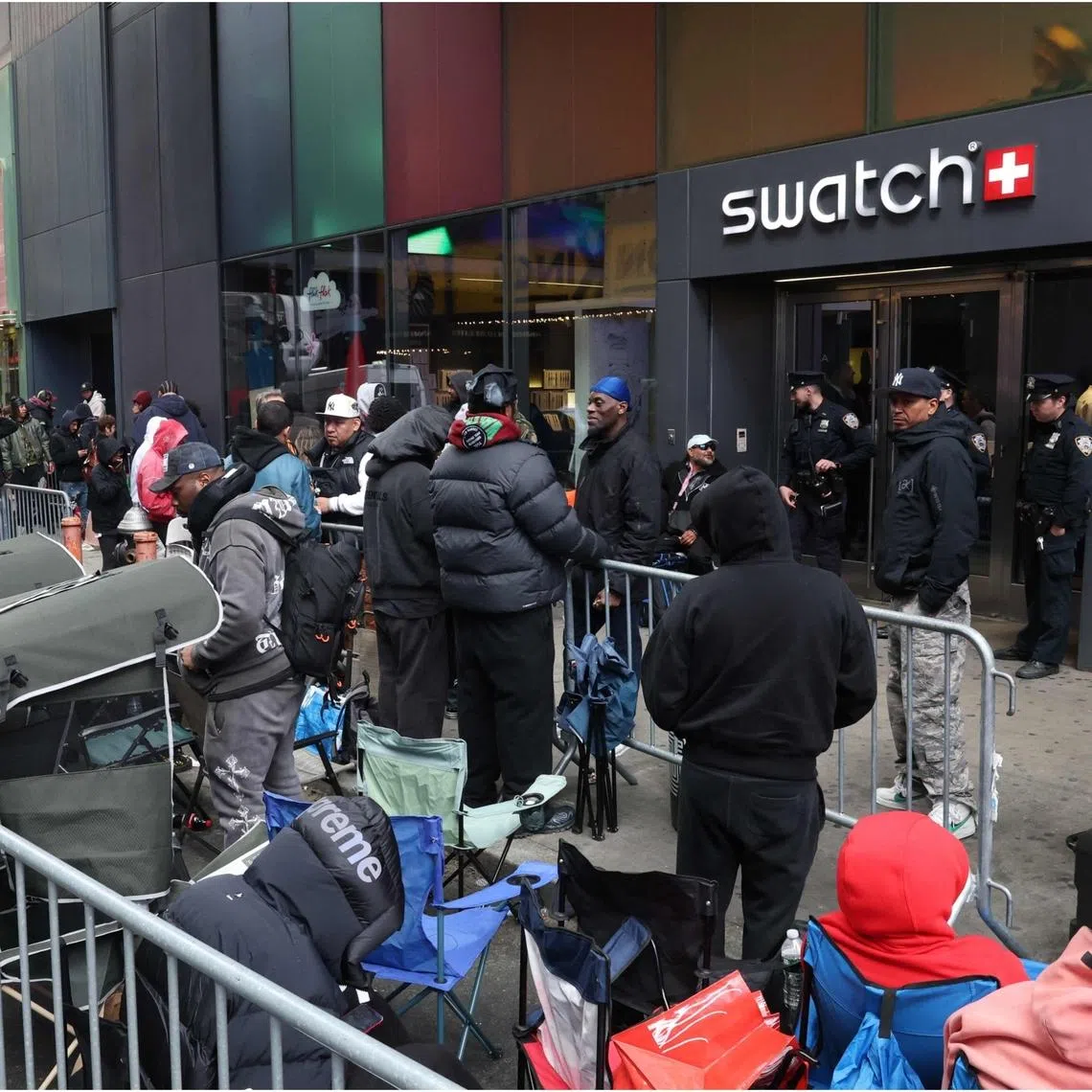 People camping out in line outside the Swatch store in Times Square, New York, ahead of the May 16 release of the Audemars Piguet x Swatch Royal Pop watch. 