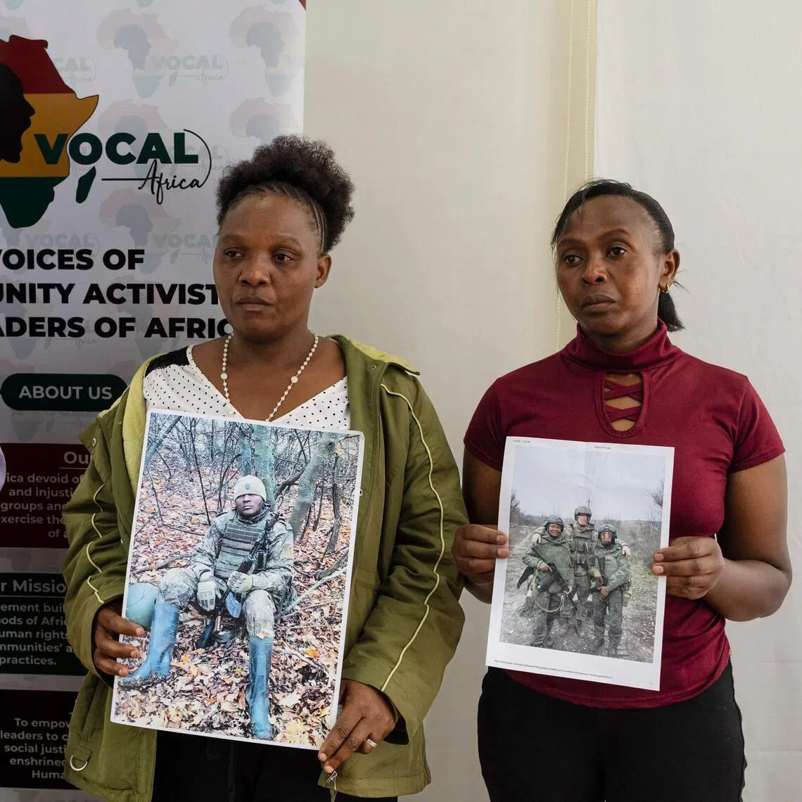 Relatives of Kenyan nationals conscripted by the Russian army to fight in Ukraine posing with photos of their family members during a press conference demanding urgent government action to repatriate their kin, in Nairobi, on Jan 27.