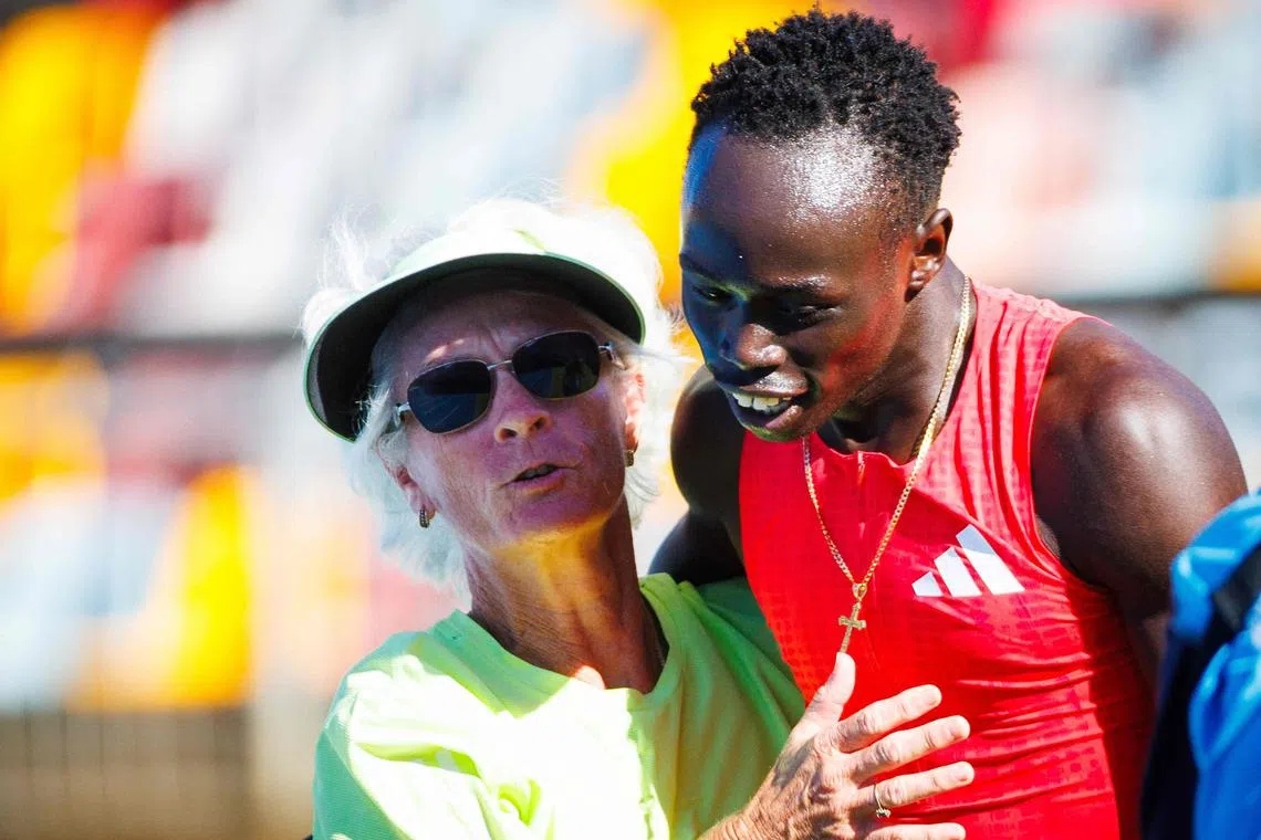 Australia's Gout Gout celebrates with his coach Diane Sheppard after winning the 200m at the Queensland State Championships in Brisbane on March 16, 2025.