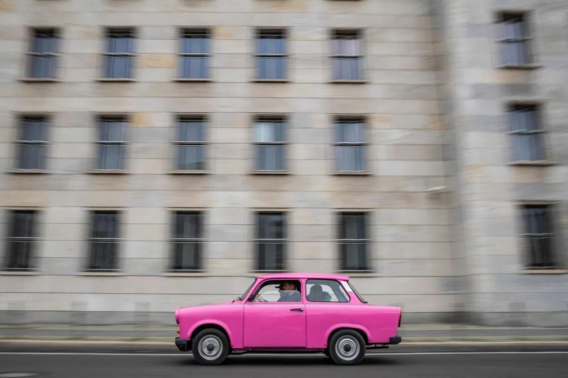 A Trabant car drives past the building that houses the Finance Ministry as it leaves the yard of Berlin's Trabiworld tour operator, which offers "Trabi Safaris" through the capital featuring the iconic east German car. 