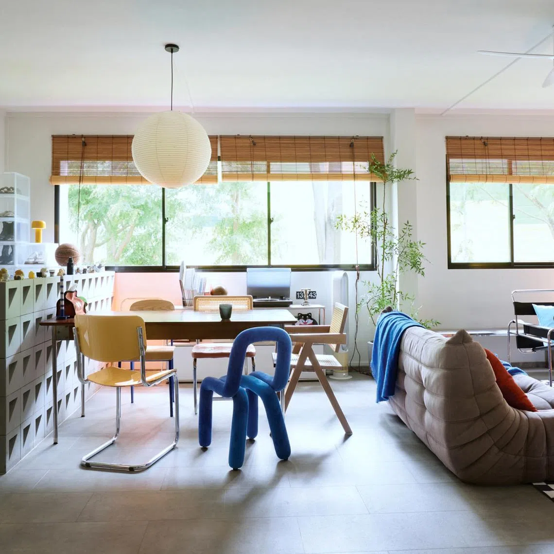 This colourful flat is home to an associate creative director and his family.