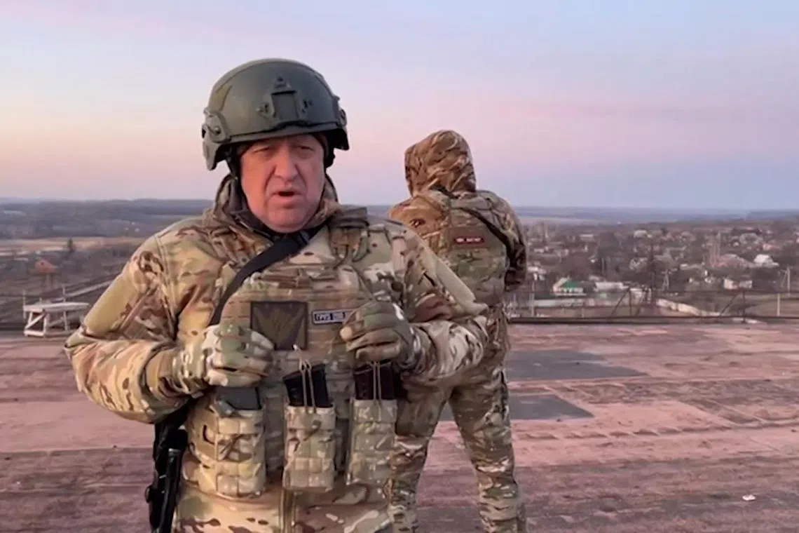 This video grab taken from a video posted on Telegram channel @concordgroup_official on March 3, shows Yevgeny Prigozhin, the chief of the Russian paramilitary group Wagner speaking to the camera from a rooftop at an undisclosed location. 