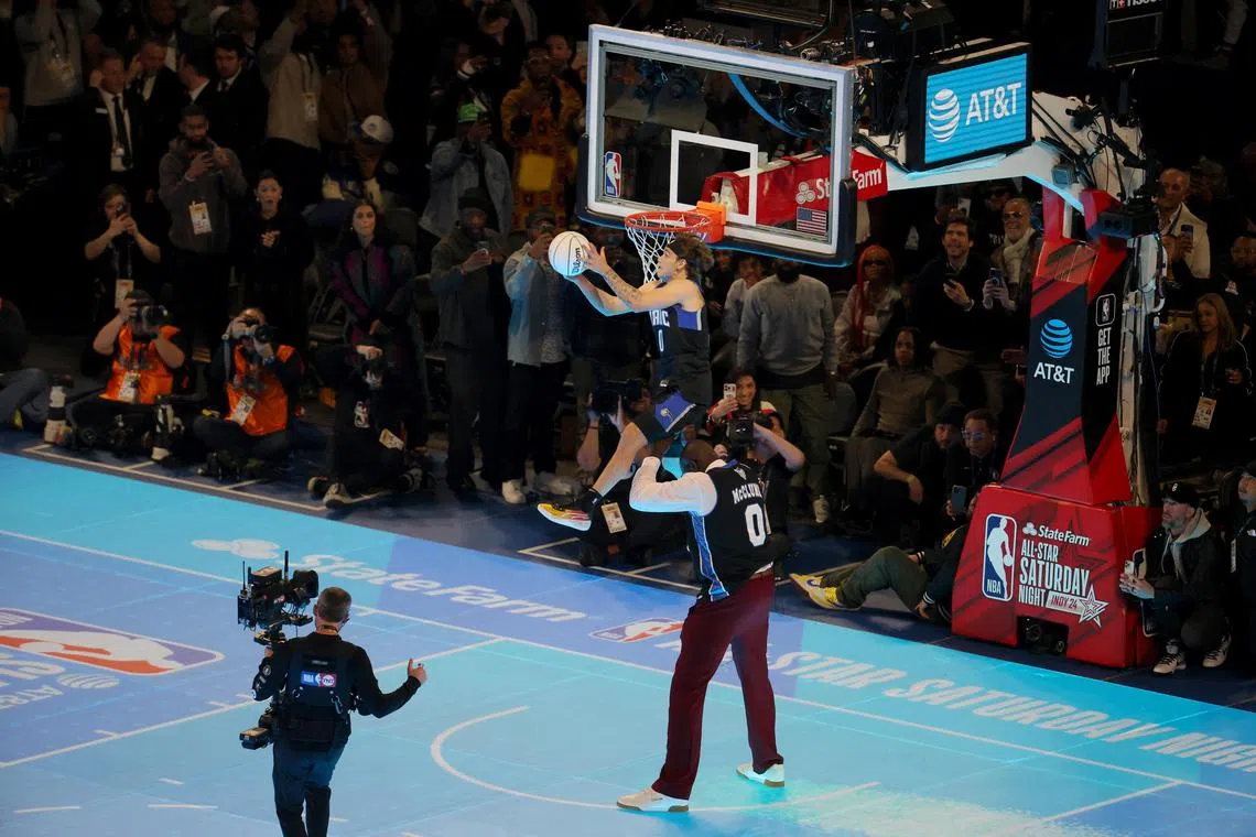 Osceola Magic guard Mac McClung executing a reverse S competing in the AT&T Slam Dunk Contest with help from Shaquille O’Neal during NBA All Star Saturday Night at Lucas Oil Stadium. Mandatory Credit: Trevor Ruszkowski-USA TODAY Sports