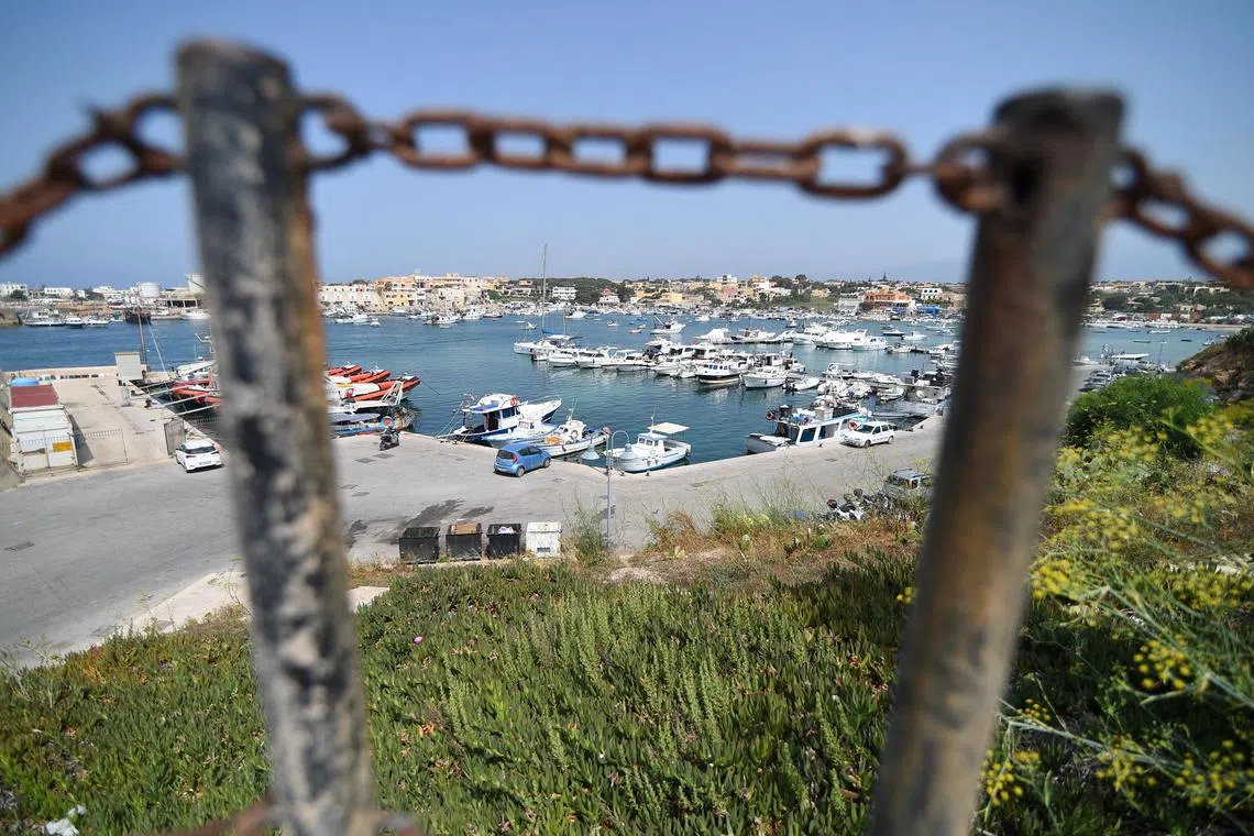 FILE PHOTO: General view of the harbour on the Sicilian island of Lampedusa, Italy, June 25, 2019. REUTERS/Guglielmo Mangiapane/File Photo