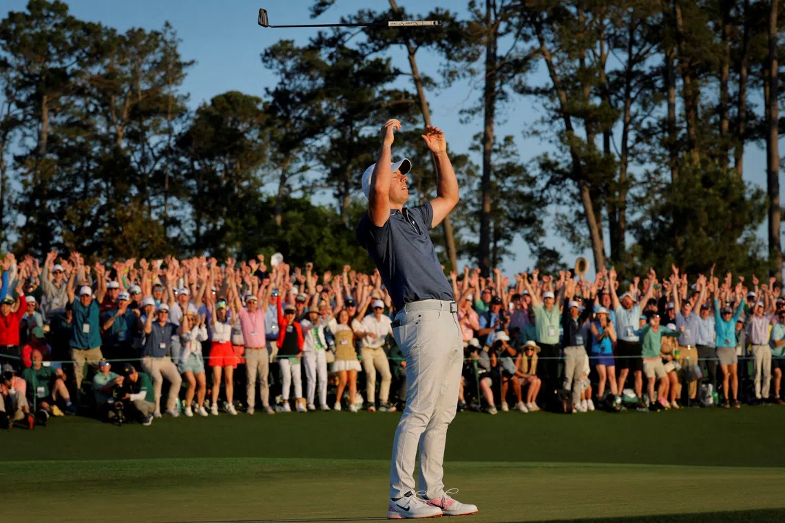 Golf - The Masters - Augusta National Golf Club, Augusta, Georgia, U.S. - April 13, 2025 Northern Ireland's Rory McIlroy celebrates on the 18th green and 1st play-off hole after winning The Masters and completing a career grand slam REUTERS/Brian Snyder