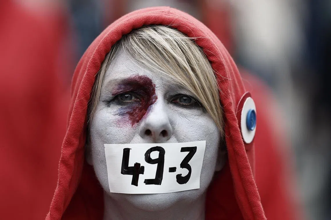 A Protestor dressed as a "Marianne" taking part in a demonstration on May Day (Labour Day), to mark the international day of the workers, more than a month after the government pushed an unpopular pensions reform act through parliament, in Lille, northern France, on May 1, 2023. 