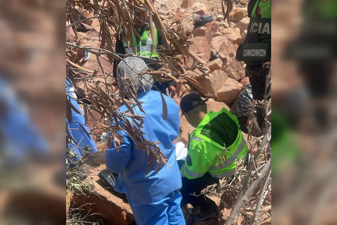Officials working at the scene of the accident in the mountainous Arequipa region of southern Peru.
