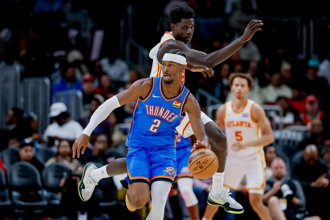 Oklahoma City Thunder guard Shai Gilgeous-Alexander leaving Atlanta Hawks forward Mouhamed Gueye in his wake during the their NBA game in Atlanta on Oct 25. 