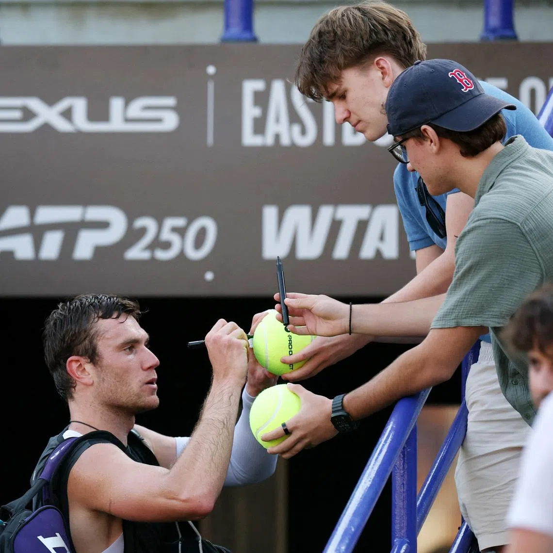 Tennis - Eastbourne Open - Devonshire Park Lawn Tennis Club, Eastbourne, Britain - June 26, 2026 Britain's Jack Draper signs autographs as he exits the court. REUTERS/Isabel Infantes