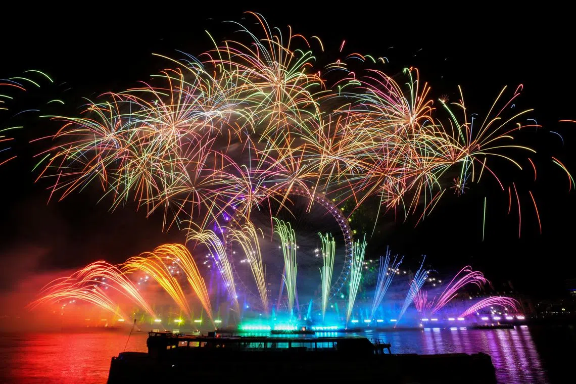 Fireworks explode over the London Eye ferris wheel as Britons across the country welcome the New Year, in London, Britain, Jan 1, 2023.  