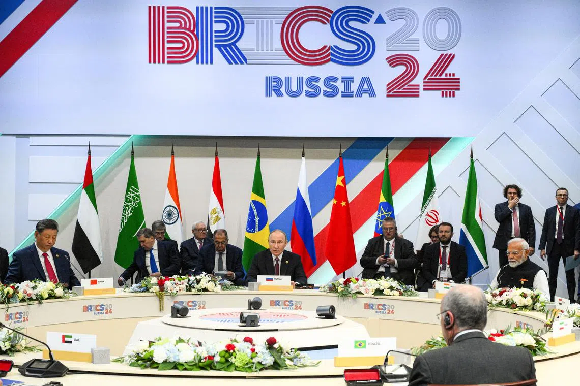 Officials, including Chinese President Xi Jinping, Russian President Vladimir Putin and Indian Prime Minister Narendra Modi, attend the BRICS summit in Kazan, Russia October 23, 2024. Alexei Danichev/BRICS-RUSSIA2024.RU Host Photo Agency via REUTERS
