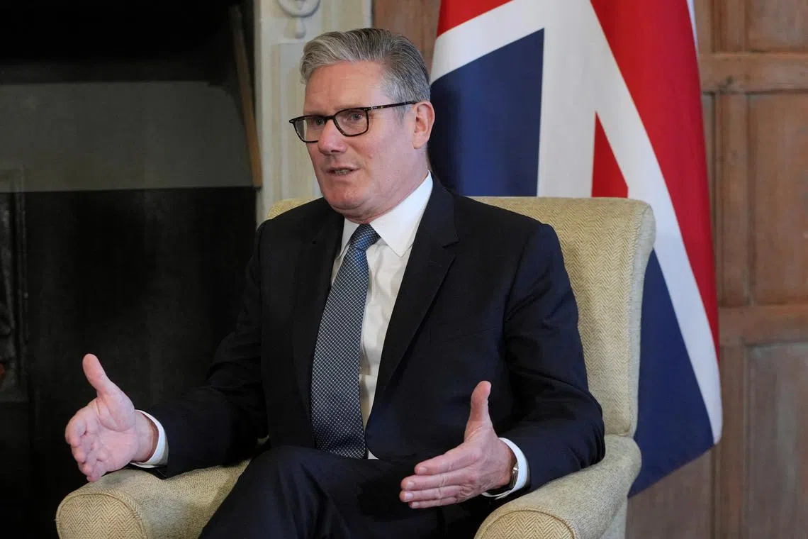Britain's Prime Minister Keir Starmer speaks to Prime Minister Narendra Modi of India (not pictured) as they meet for bilateral talks at Chequers near Aylesbury, England, Thursday, July 24, 2025.    Kin Cheung/Pool via REUTERS