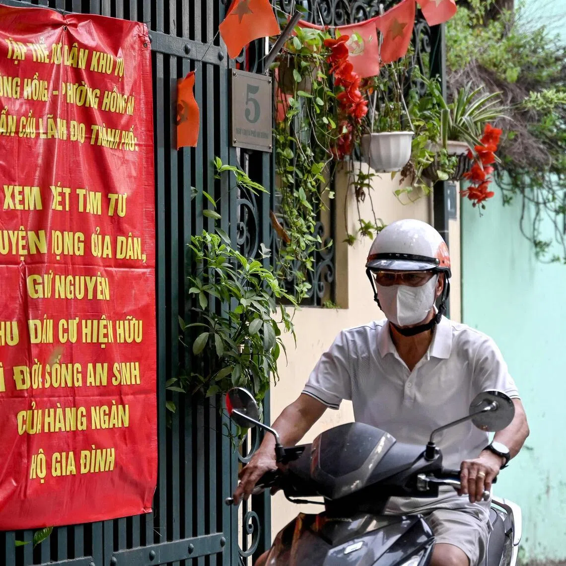 Dozens of similar banners have appeared on houses in Hanoi, with many disappearing after a few days.