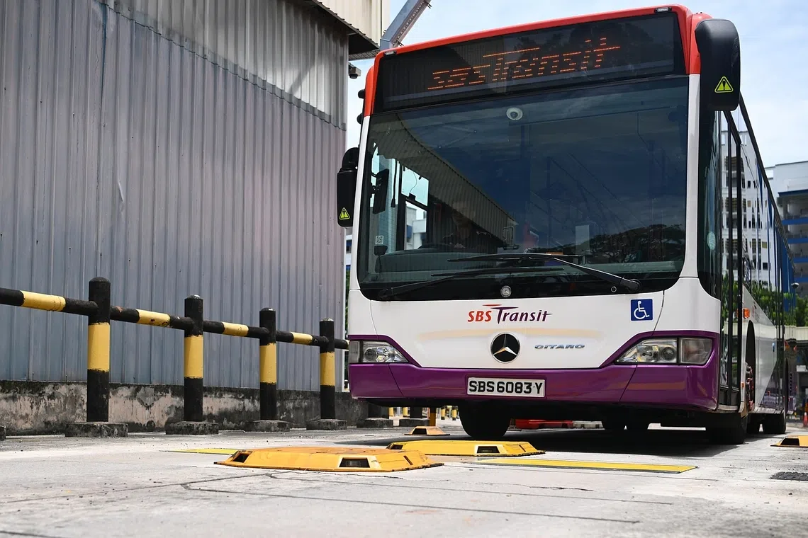 The automated Tyre Management System, which uses cameras, strobe lights and ground sensors, installed on the road surface at Ulu Pandan Bus Depot on Sept 12. 