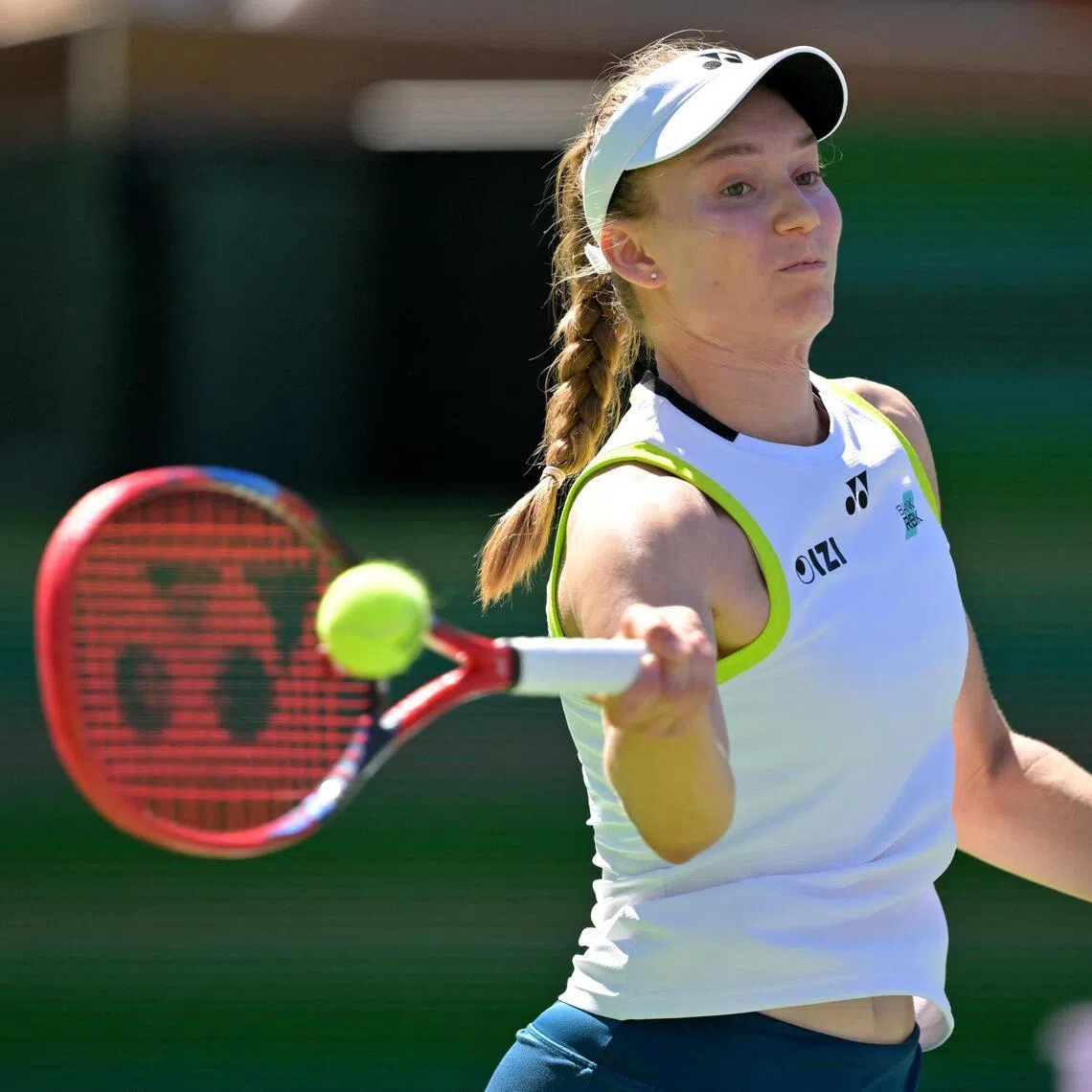 Elena Rybakina hits a shot during her second round match against Hailey Baptiste in the BNP Paribas Open at the Indian Wells Tennis Garden. 